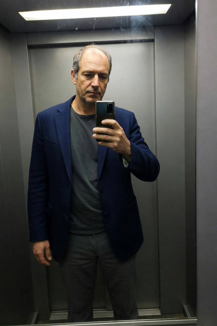 Navy Blazer Layered Over Grey for Understated Daylong Poise