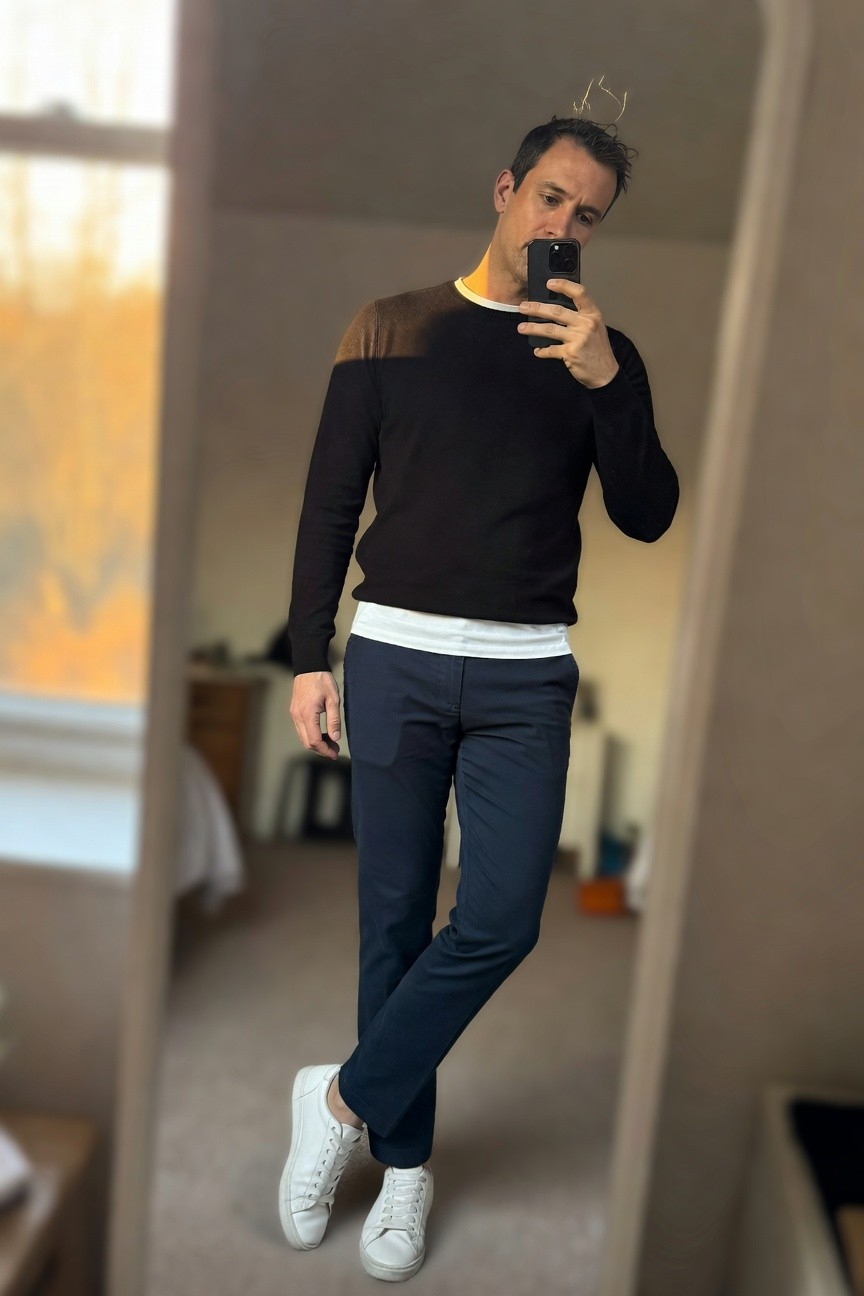 Black Sweater Layered over White Tee with Navy Pants