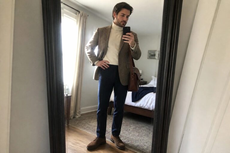 20 Stylish Old Money Fall Outfits for Men With Tweed Jackets Man in brown tweed blazer and cream turtleneck taking mirror selfie in bedroom