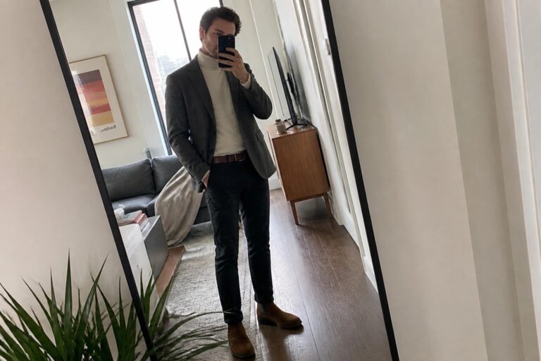 23 Bold Men’s Fall Semi Formal Outfits Built Around Unstructured Blazers Man in gray blazer and cream turtleneck taking mirror selfie in bedroom